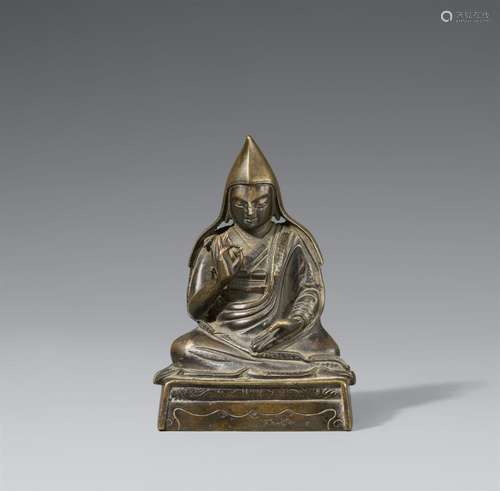 A bronze figure of a Gelugpa lama. Tibet, 17th/18th century