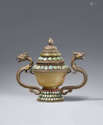 A silver-mounted and inlaid turquoise, coral and jade-embell...