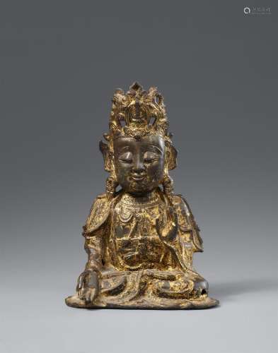 A gilded and lacquered bronze figure of Guanyin. Ming dynast...