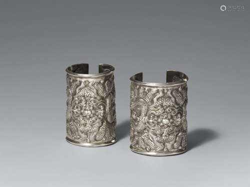 A pair of silver bracelets for women. Southwestern China, Gu...