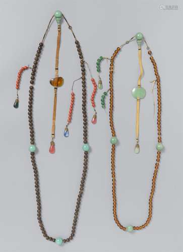 Two court necklaces (chaozhu) of glass and wood and other ma...