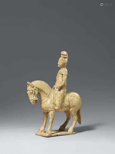 A straw-glazed pottery horse and female rider. Sui dynasty (...