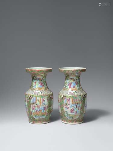 A pair of Canton famille rose vases. Qing dynasty, 19th cent...