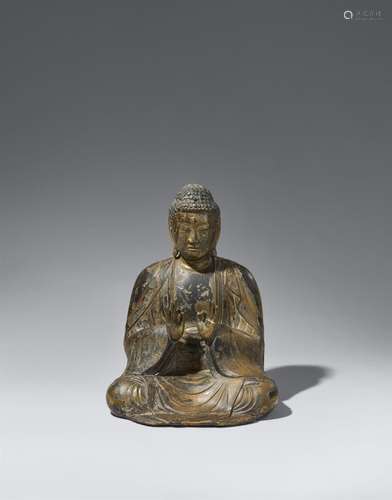 A wood figure of a Buddha. 12th century or later