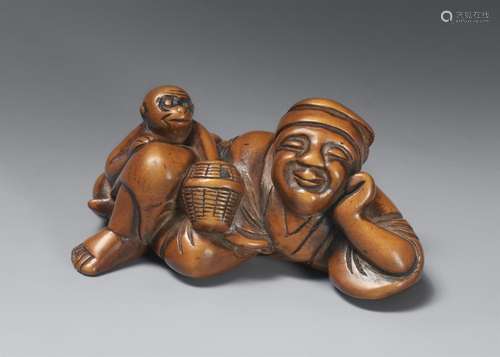 A boxwood netsuke of a sleeping sarumawashi. Around 1800