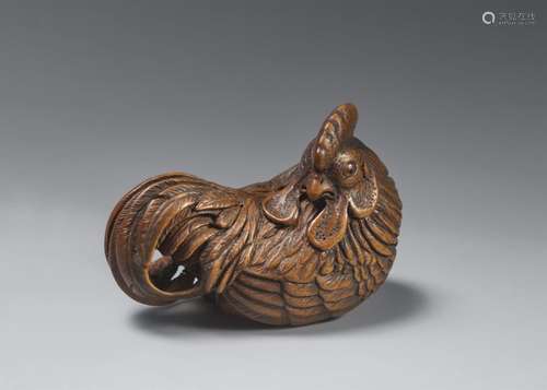 A wood netsuke of a proud rooster.