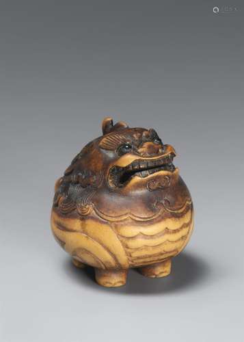 A partly stained boxwood netsuke of a censer in the shape of...