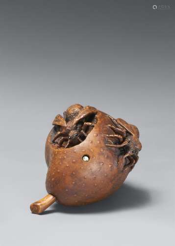 A contemporary boxwood netsuke of a pear and two wasps by Al...