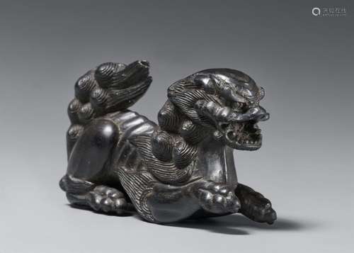 A large kokutan netsuke of a shishi. 19th century