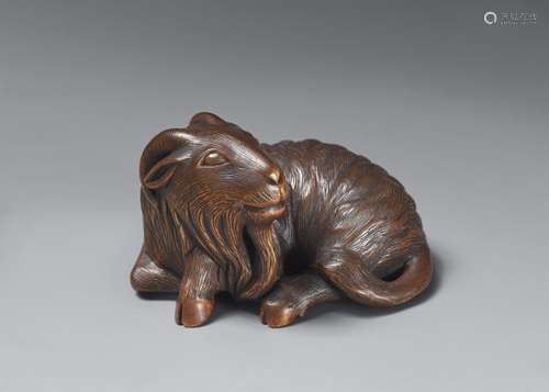 An Ise-Yamada boxwood netsuke of a long-haired goat. Around ...