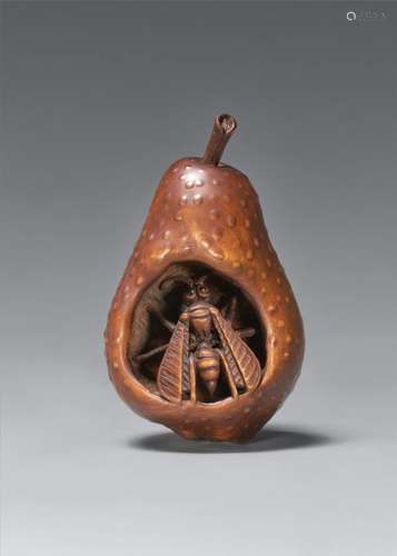 A wood netsuke of a wasp in rotting pear. In the style of Sa...