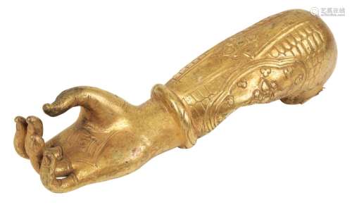 A TIBETAN GILT COPPER LOWER ARM AND HAND