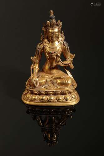 A SINO-TIBETAN GILT BRONZE OF MAITREYA