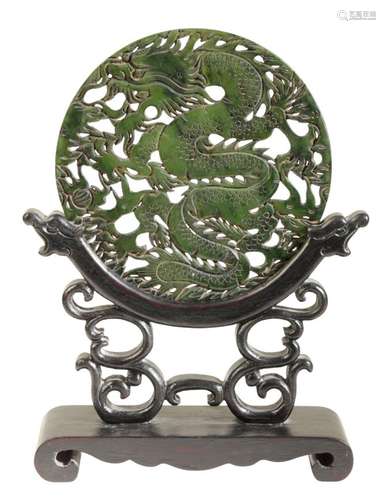 A CHINESE DARK GREEN BOWENITE CIRCULAR PLAQUE