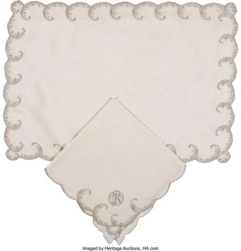 A Sixteen-Piece Set of Embroidered Linen Place Mats and Napk...