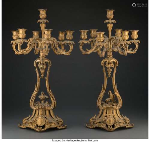 A Pair of Christofle Gilt Bronze Seven-Light Figural Candela...