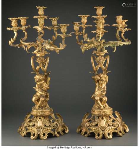 A Pair of Gilt Bronze Figural Seven-Light Candelabra, late 1...