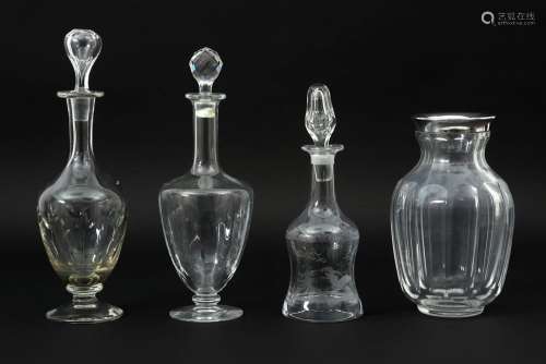 three decanters in glass and a vase in crystal and silver