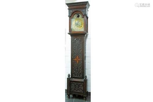 antique English clock with oak case and with a work with sma...