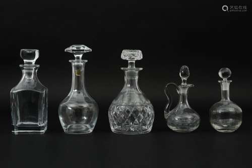 five decanters/claret jugs in crystalglass