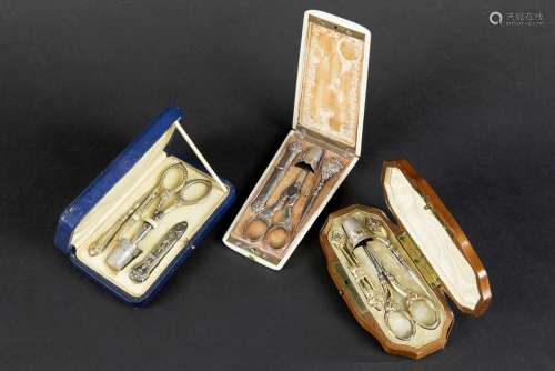 three antique sewing sets in silver with their cas…