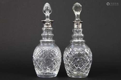 two English decanters in crystal and marked silver…
