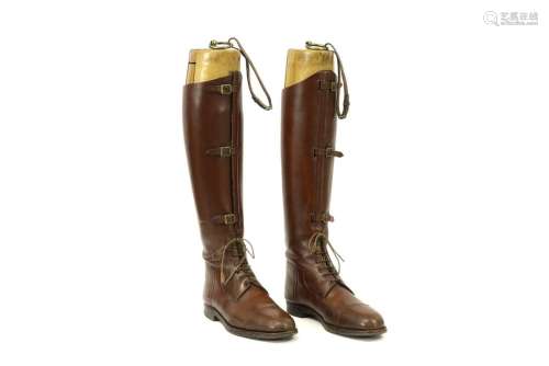 pair of `antique` high boots in leather with a woo…