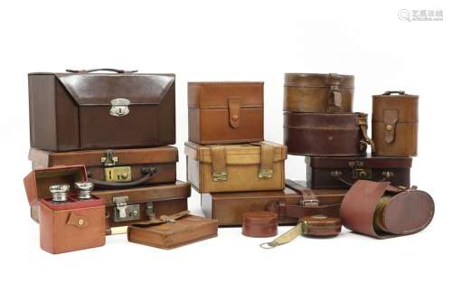 collection of old and antique leather cases and bo…