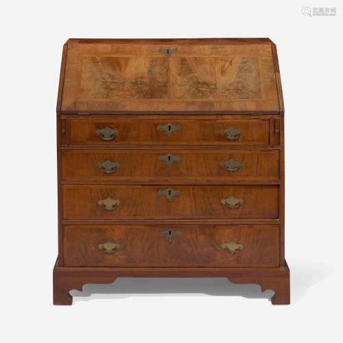 A Queen Anne walnut-banded and pine slant-front desk circa 1...