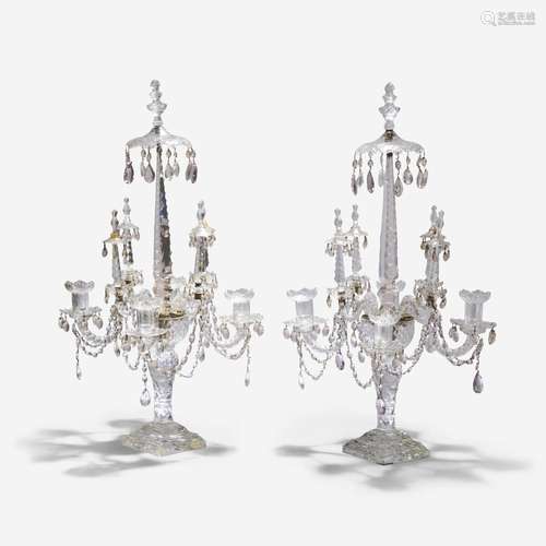 A pair of elaborate Georgian cut-glass four-light candelabra...