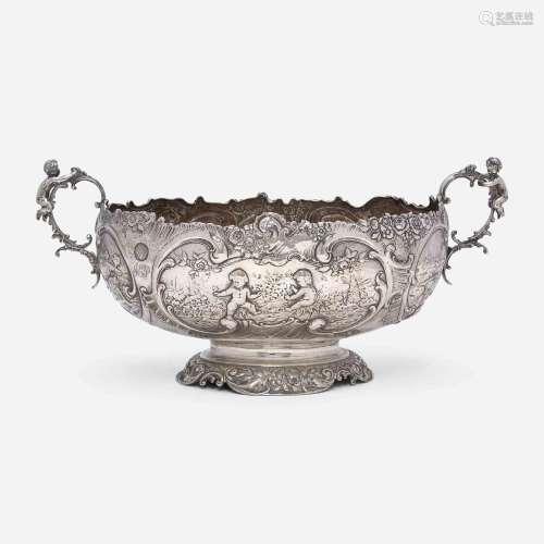 A Continental silver repoussé two-handled centerpeice Likely...