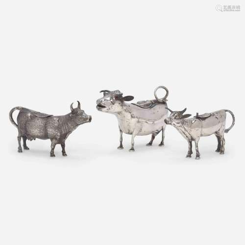 A group of three Continental silver cow creamers 19th / earl...