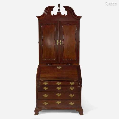 A Chippendale carved mahogany secretary desk and bookcase Po...