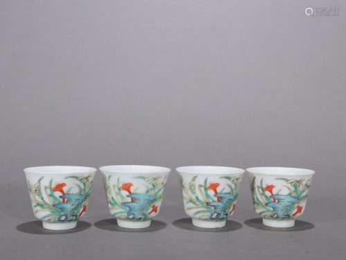 A set of tea cups with pastel orchid pattern