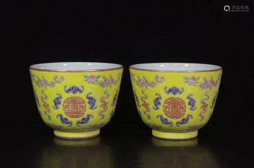 A pair of yellow-ground famille rose Wufu holding birthday c...