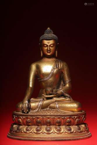 A gilt-bronze inlaid silver statue of Sakyamuni