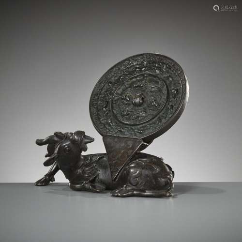 A BRONZE ‘XINIU’ MIRROR STAND AND ‘LION AND GRAPEVINE’ MIRRO...