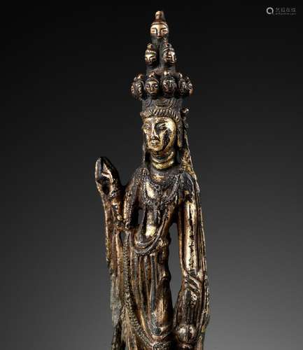 A GILT BRONZE FIGURE OF THE ELEVEN-HEADED AVALOKITESHVARA, T...