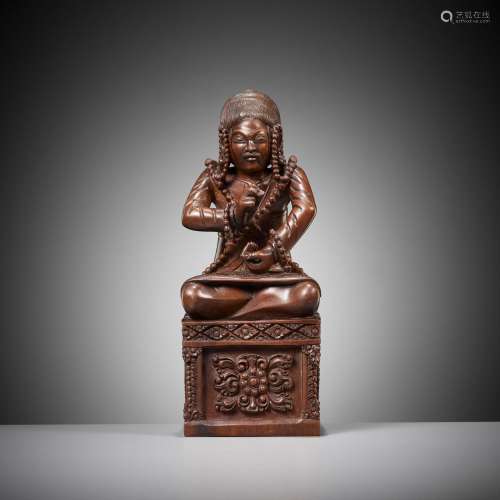 A MASTERFULLY CARVED HARDWOOD FIGURE OF A BUDDHIST PRIEST, S...