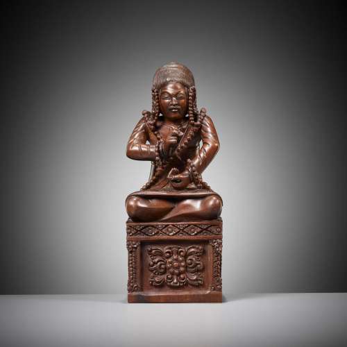 A MASTERFULLY CARVED HARDWOOD FIGURE OF A BUDDHIST PRIEST, S...