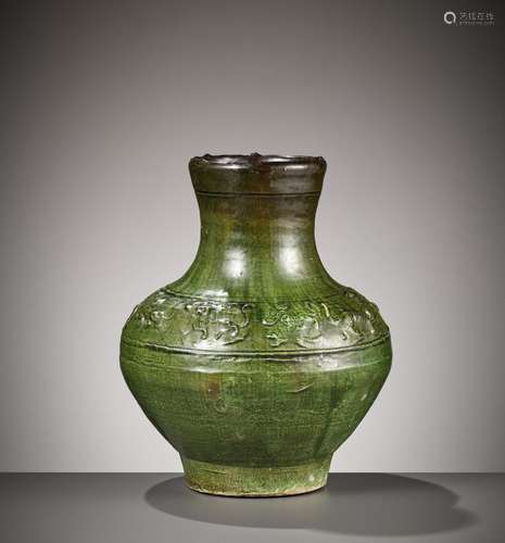 AN EMERLAD-GREEN GLAZED ‘HUNTING SCENE’ POTTERY VASE, HAN DY...