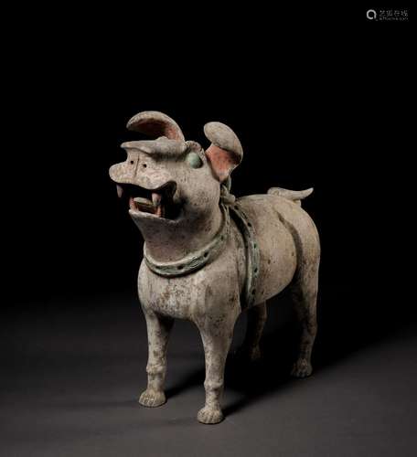 A MASSIVE PAINTED POTTERY FIGURE OF A GUARDIAN DOG, LATE EAS...