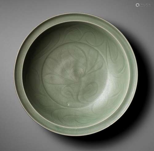 A CARVED LONGQUAN CELADON ‘LOTUS’ CHARGER, MING DYNASTY