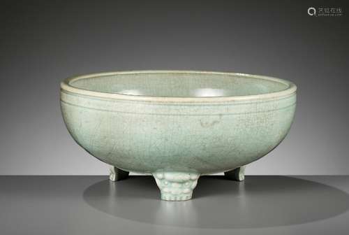 A CARVED AND MOLDED LONGQUAN CELADON TRIPOD CENSER, MING DYN...