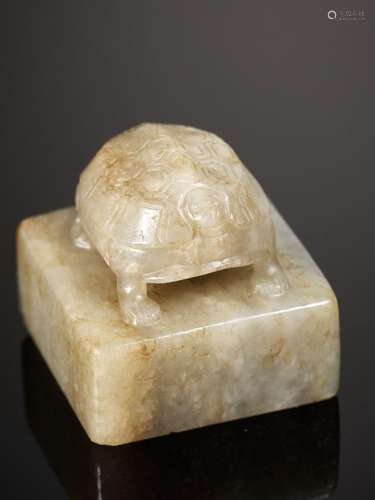 A CELADON JADE ‘TURTLE’ SEAL, 17TH CENTURY