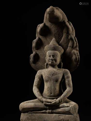 A LARGE SANDSTONE FIGURE OF BUDDHA MUCHALINDA, ANGKOR PERIOD