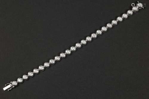 matching bracelet in white gold (18 carat) with at least 3 c...