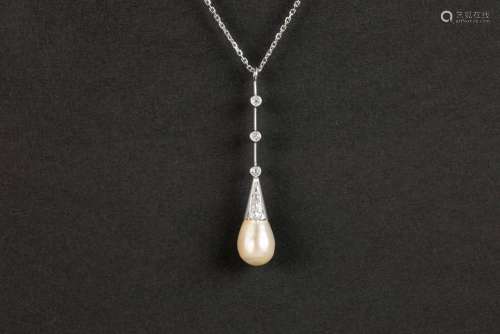 natural pearl set on an antique pendant in platinum with hig...