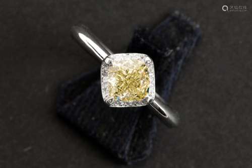 a 1,38 carat fancy yellow high quality princess' cut diamond...
