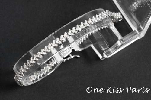 French "One Kiss Paris" signed bracelet in white g...